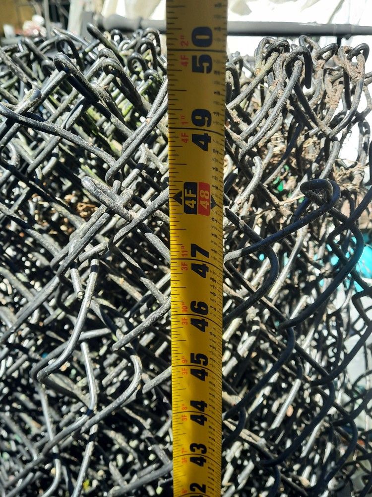 A Roll Of Black Vinyl Coated 4' Chainlink Fence