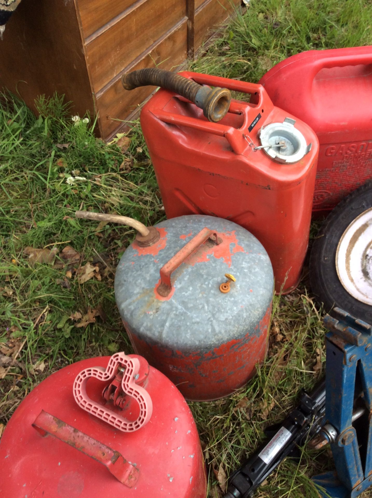 Gas can lot, tow straps, car jacks, trailer tires(2), tow hitch