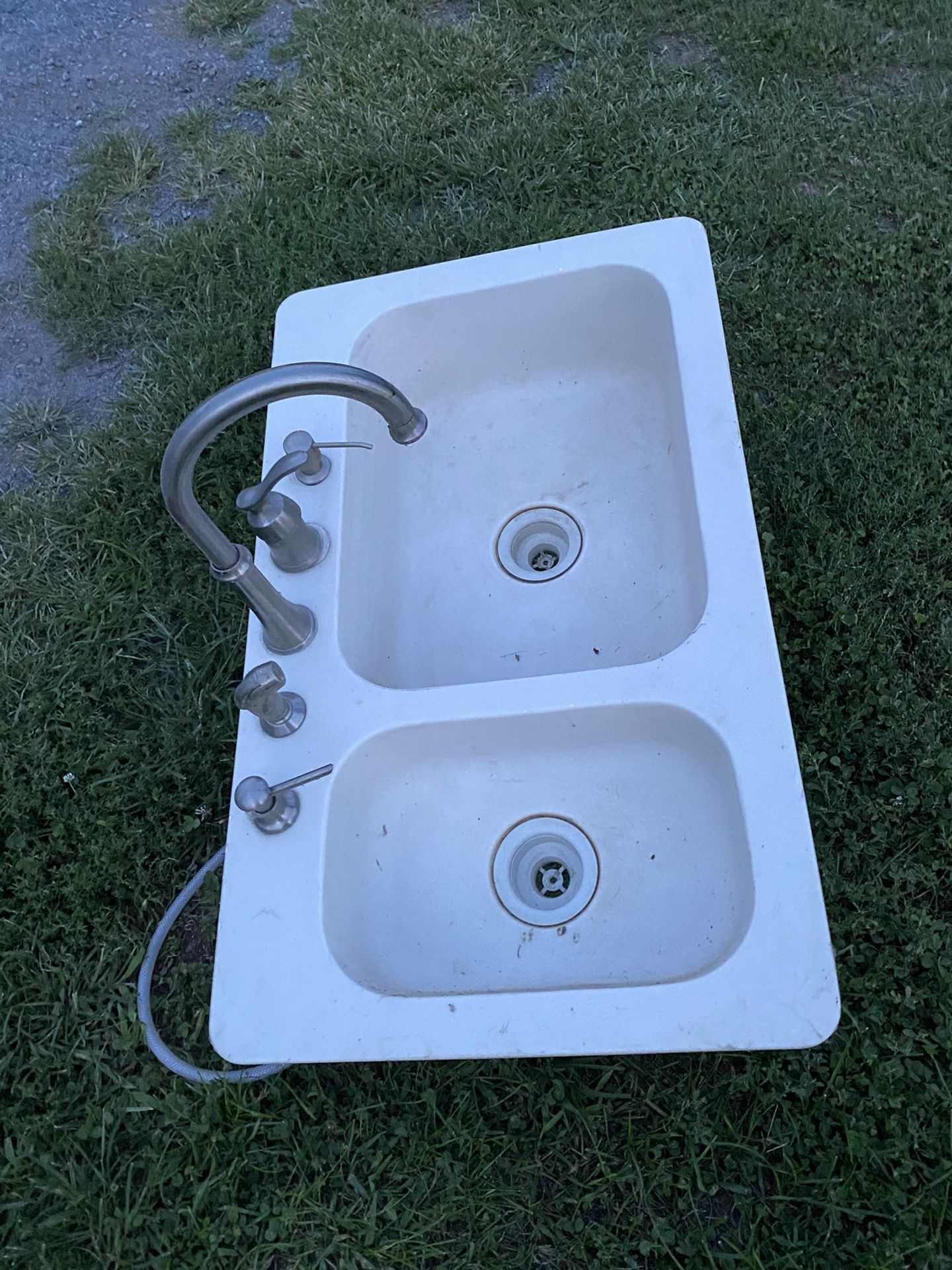 Corian double bowl kitchen sink and faucet