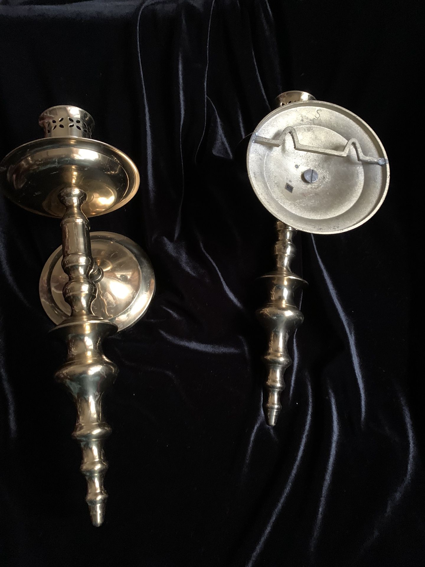 Brass wall candle holders.