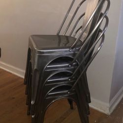 4 gunmetal stackable Chairs Thumbnail
