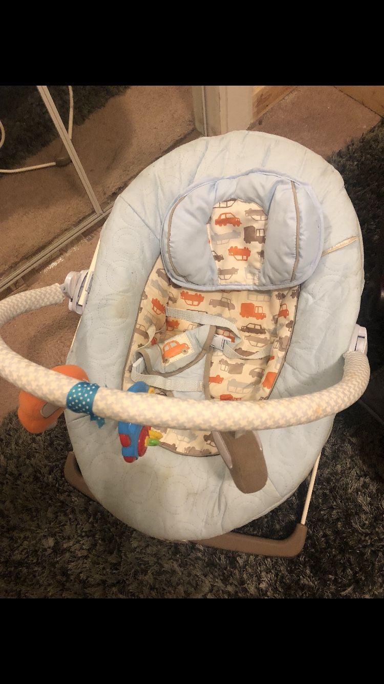 Baby bed, mattress, bouncer, activity seat , 3 bags of baby cloths car seat and excersor