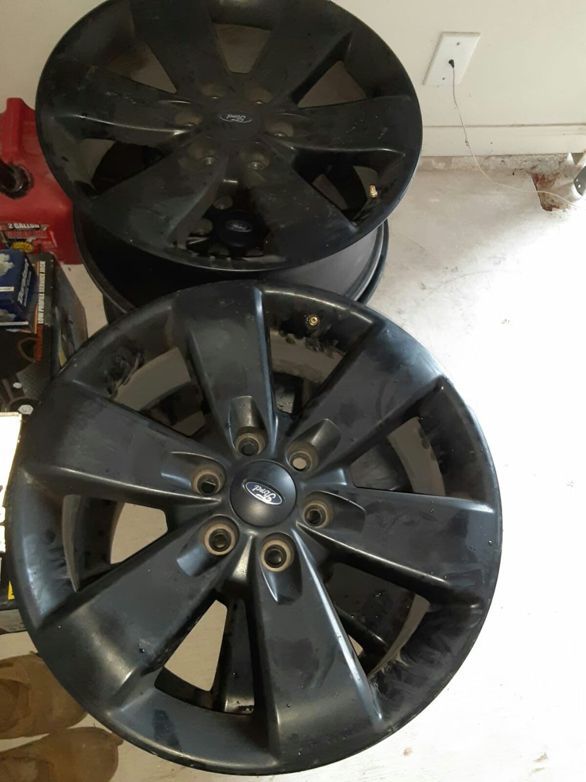 F150 stock rims for sale in black 20 inches 250 for all 4of them with lug nuts