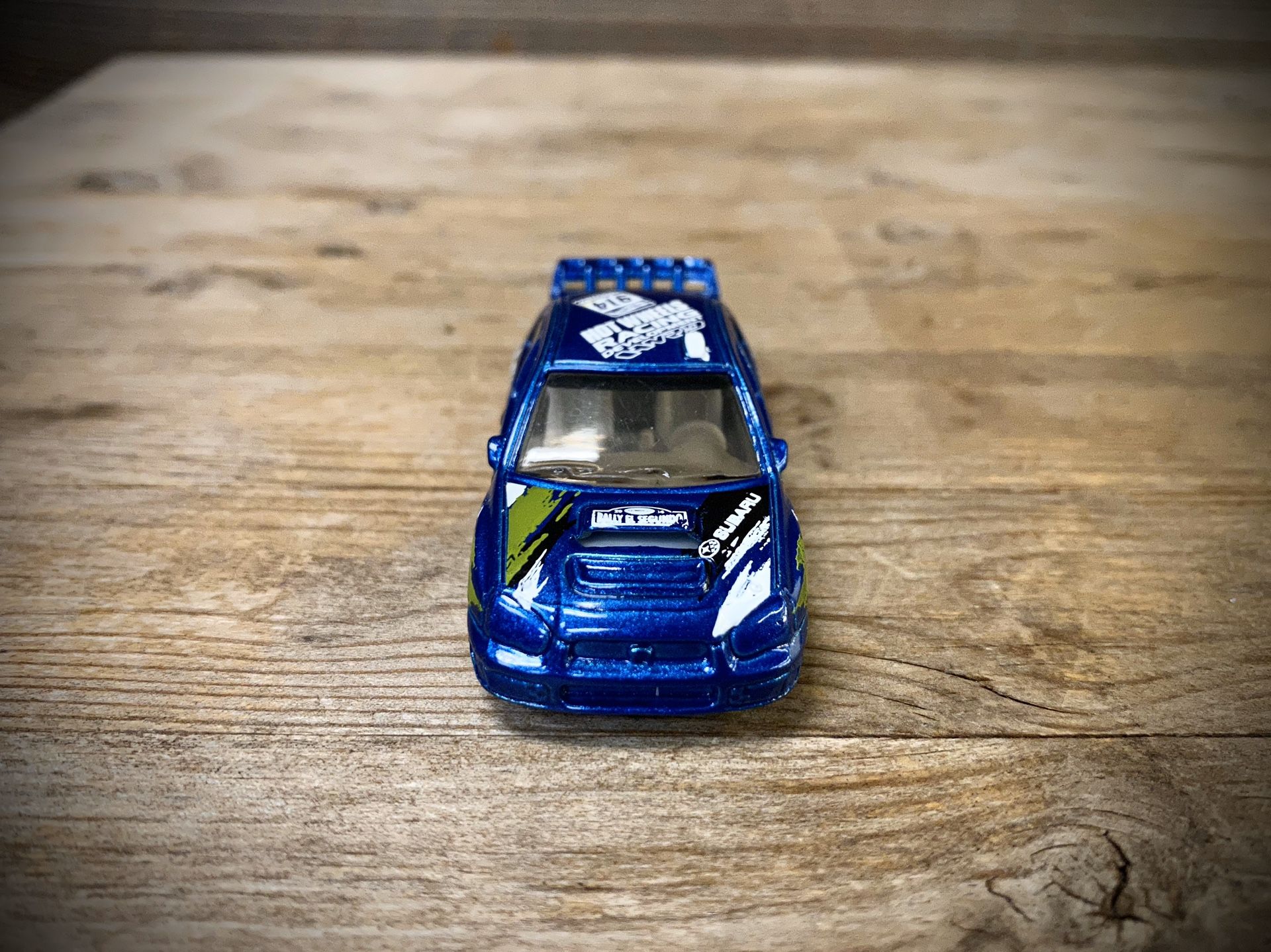 REPACKAGED CUSTOM 1:64 Subaru Impreza WRX - Hot Wheels (Lowered + camber with upgraded premium 7-spoke white wheels)