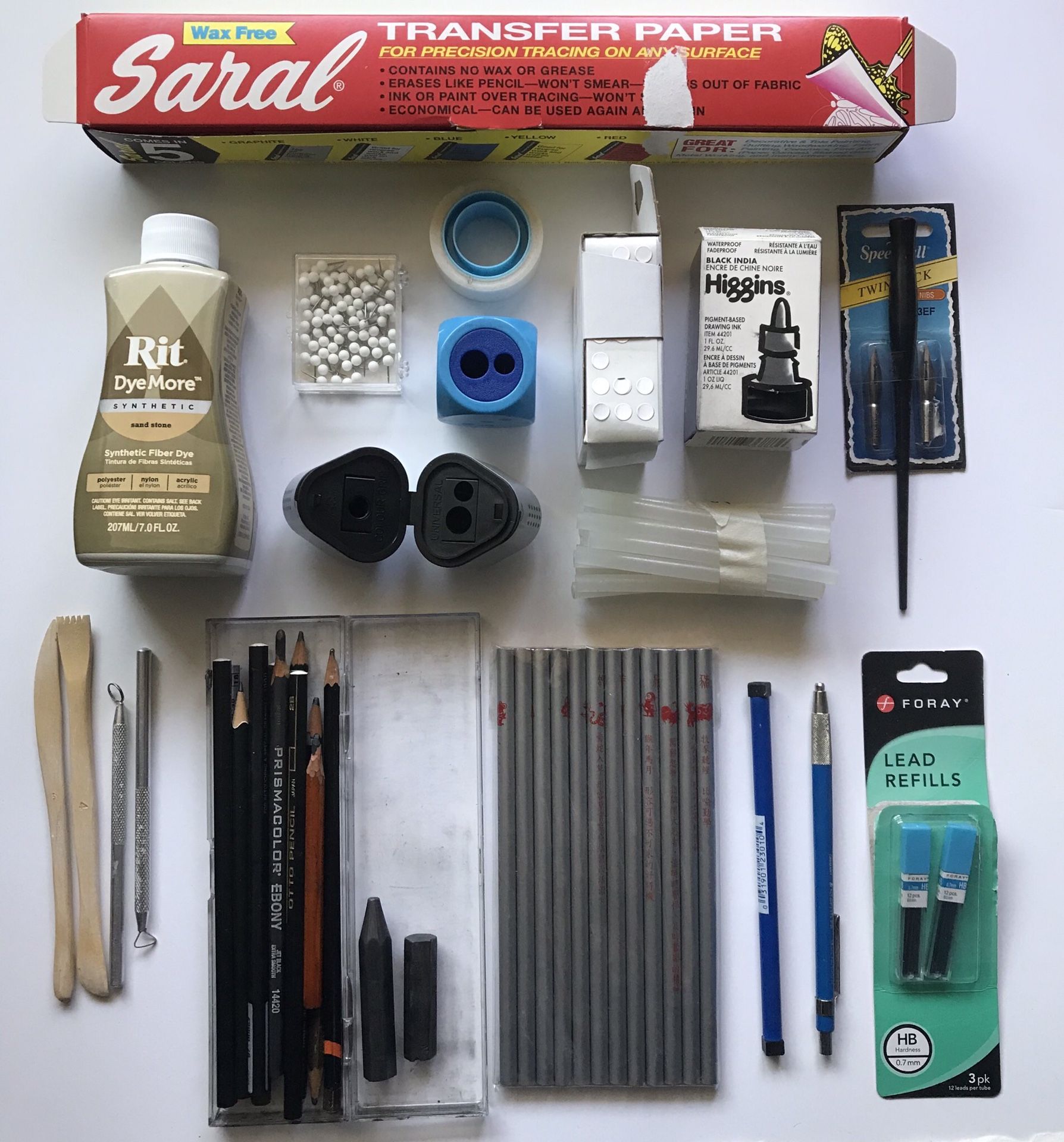 A box of drawing and crafting supplies