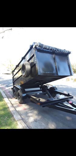 NEW DUMP TRAILER 12FT EQUIPPED ROLLING TARP AND SPARE TIRE REMOTE CONTROL ELECTRIC BRAKES LIGHTS,READY FOR WORK TITLE IN HAND FOR ANY QUESTION TEXT ME Thumbnail