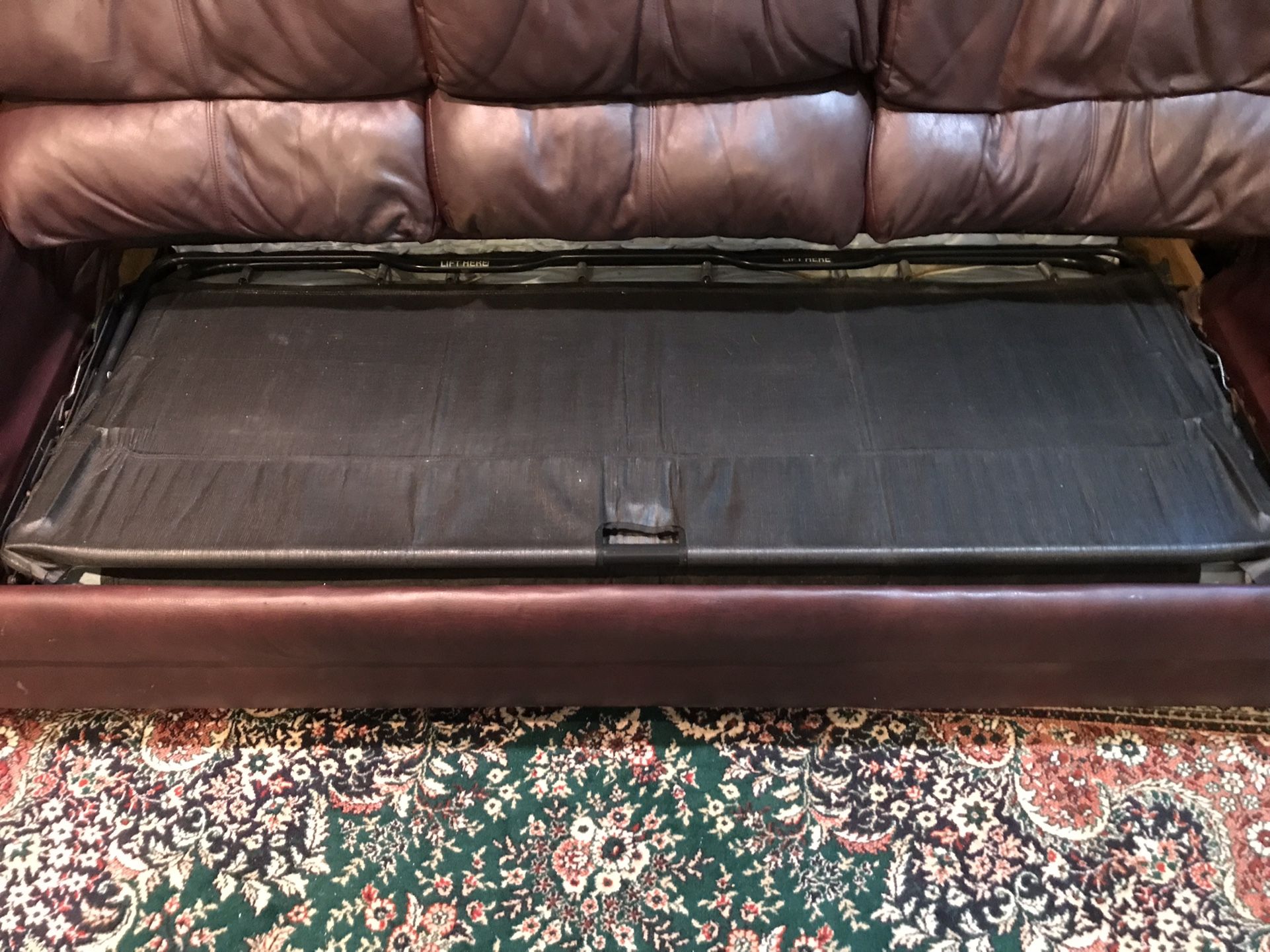 Burgundy Faux leather sofa couch with pull out mattress/bed sleeper