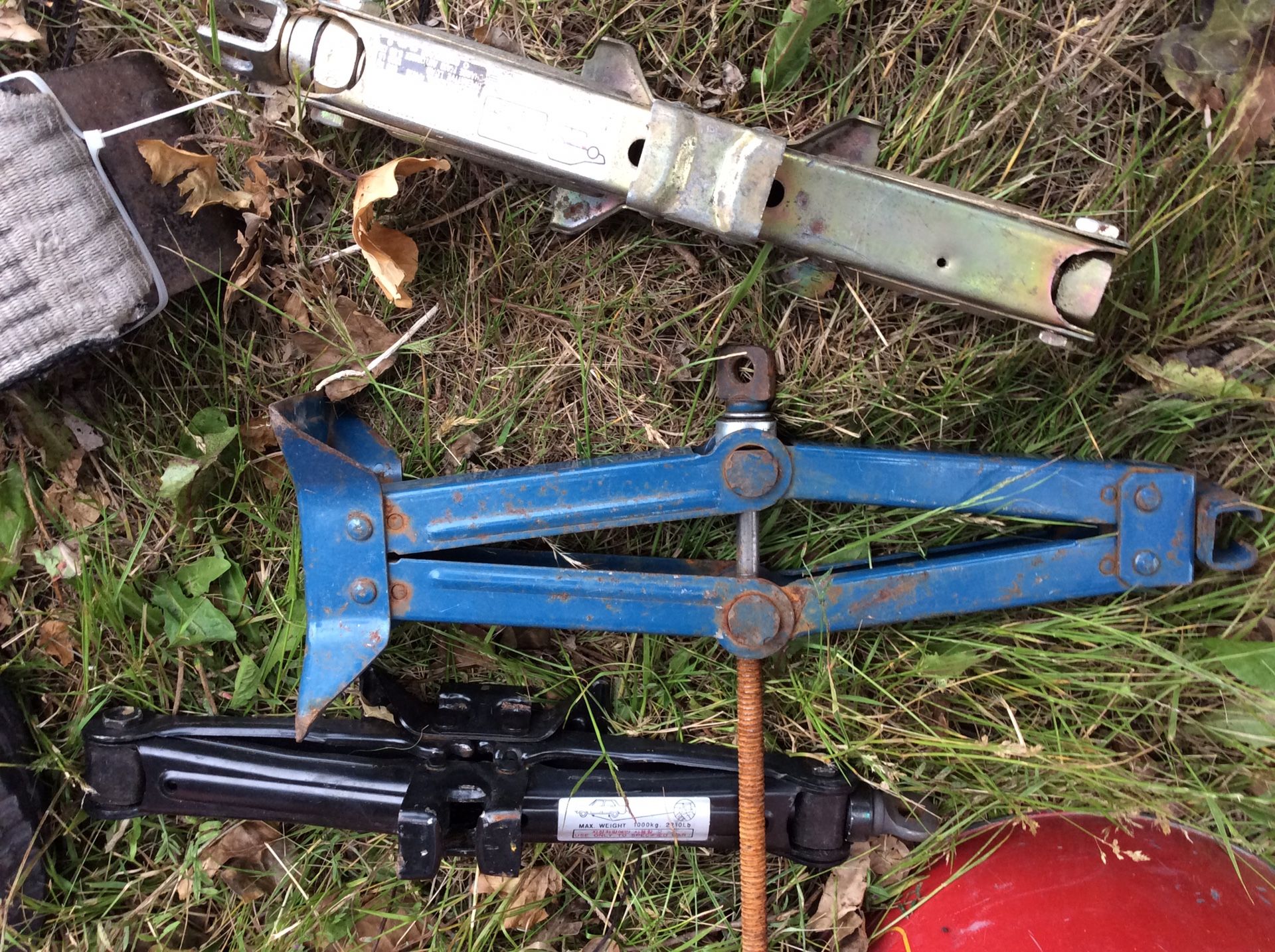 Gas can lot, tow straps, car jacks, trailer tires(2), tow hitch