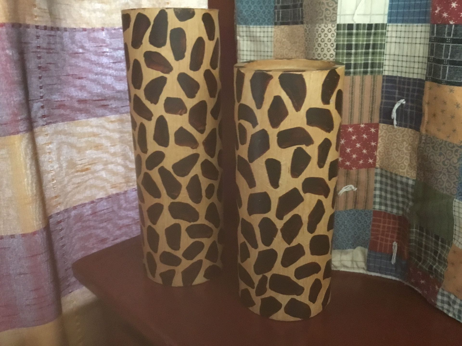 TWO WOODEN LEOPARD PILLAR CANDLE HOLDERS