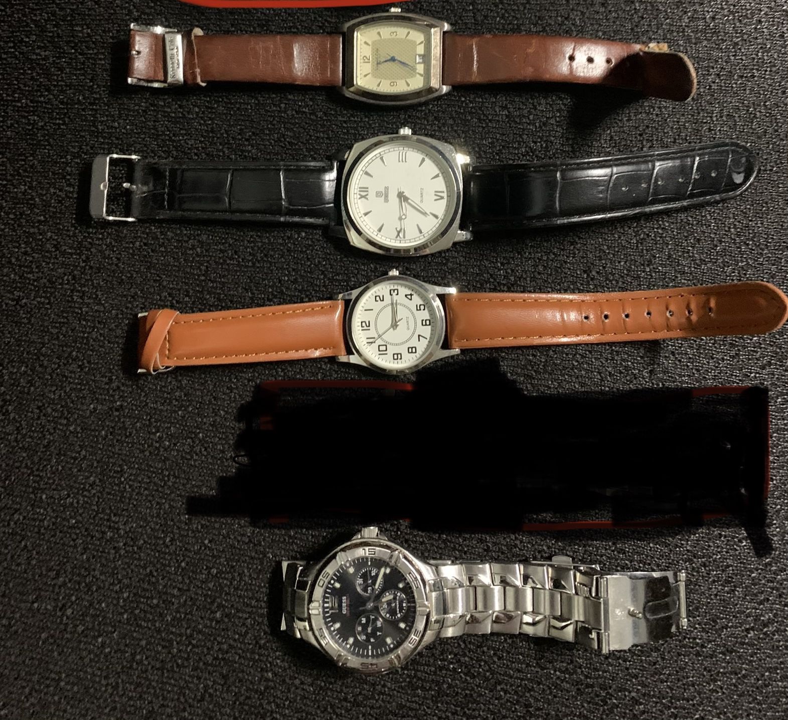 Collection of 4 men’s wrist watches
