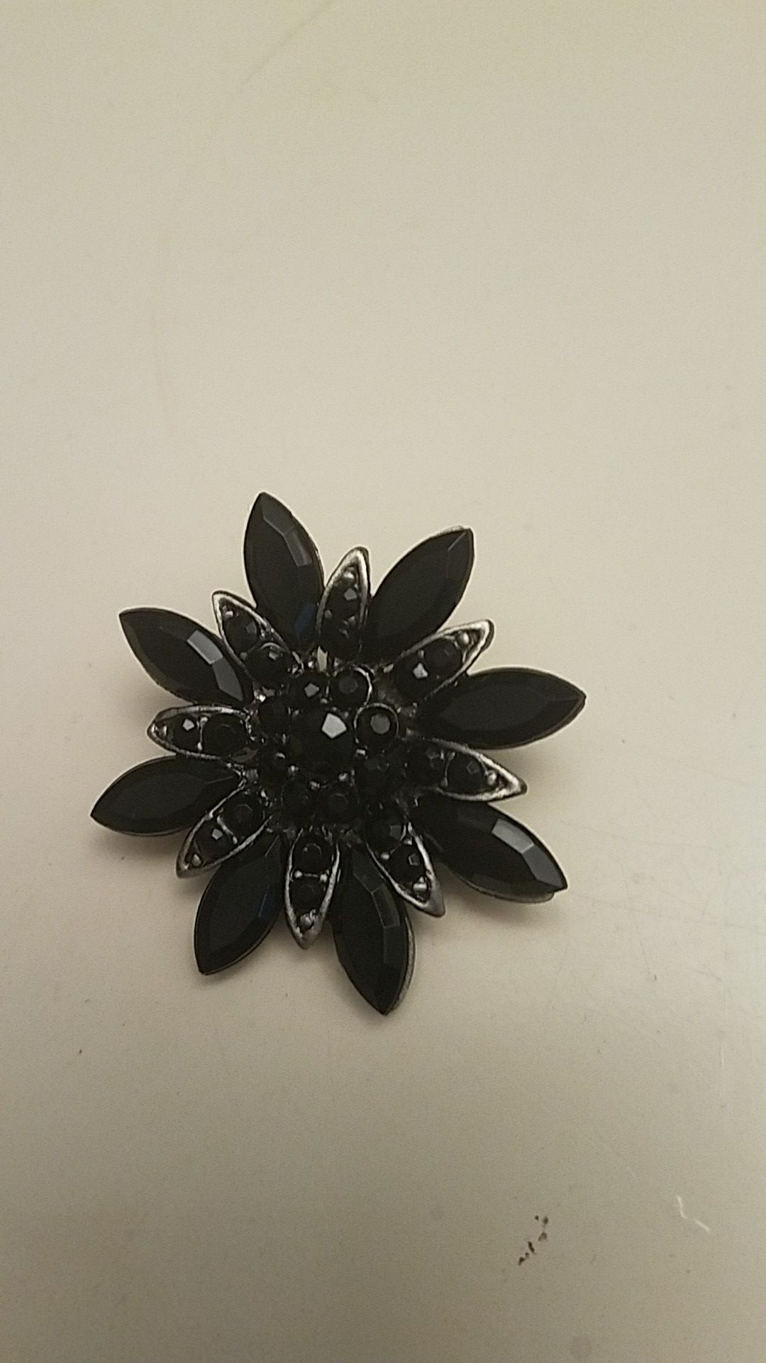 A black brooch
