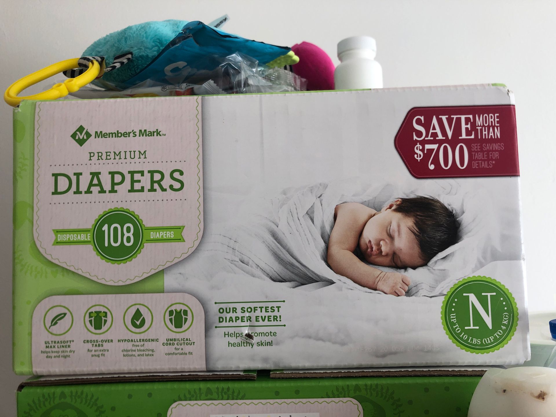 2 boxes of Members mark diapers(NB)