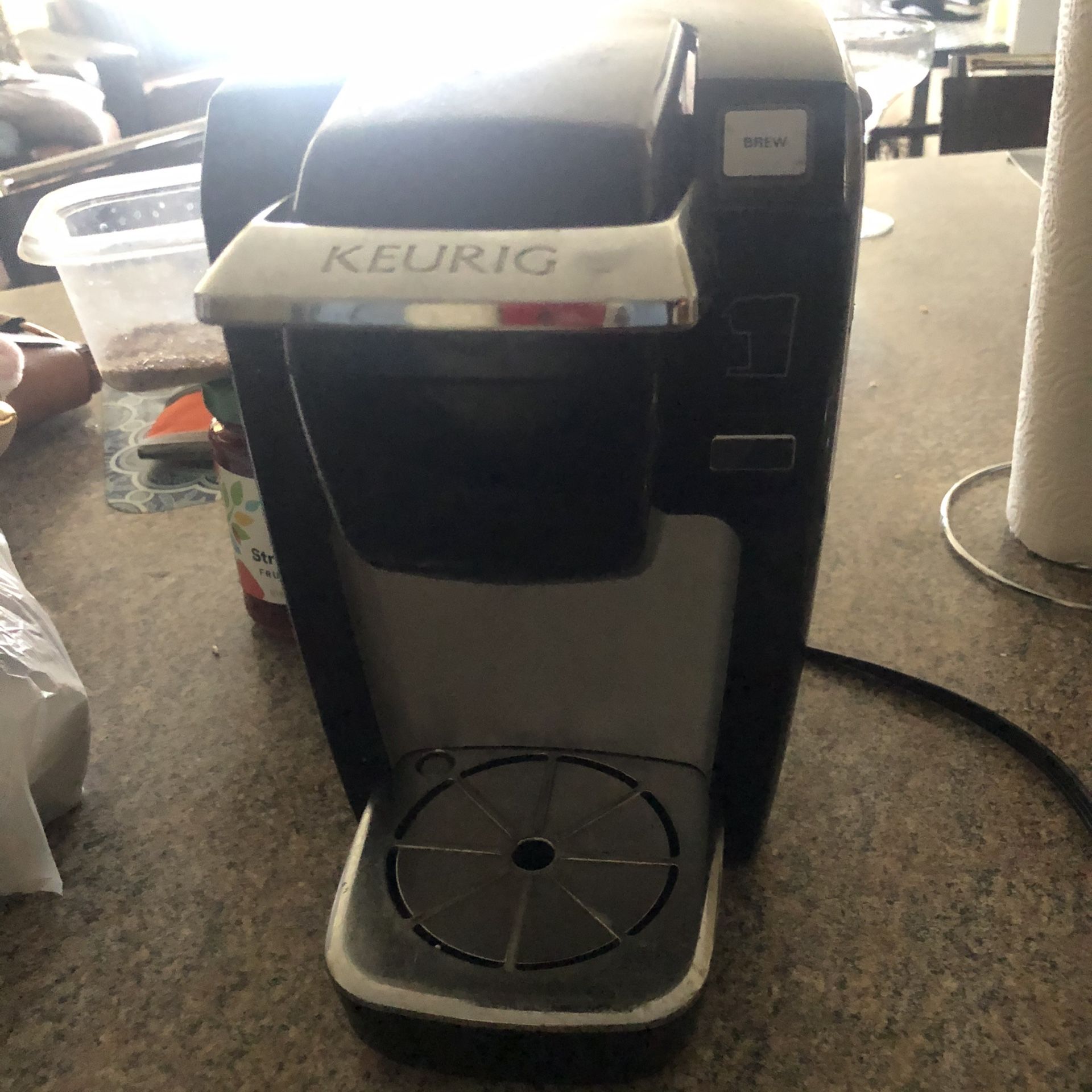 Kurieg and coffee cup holder
