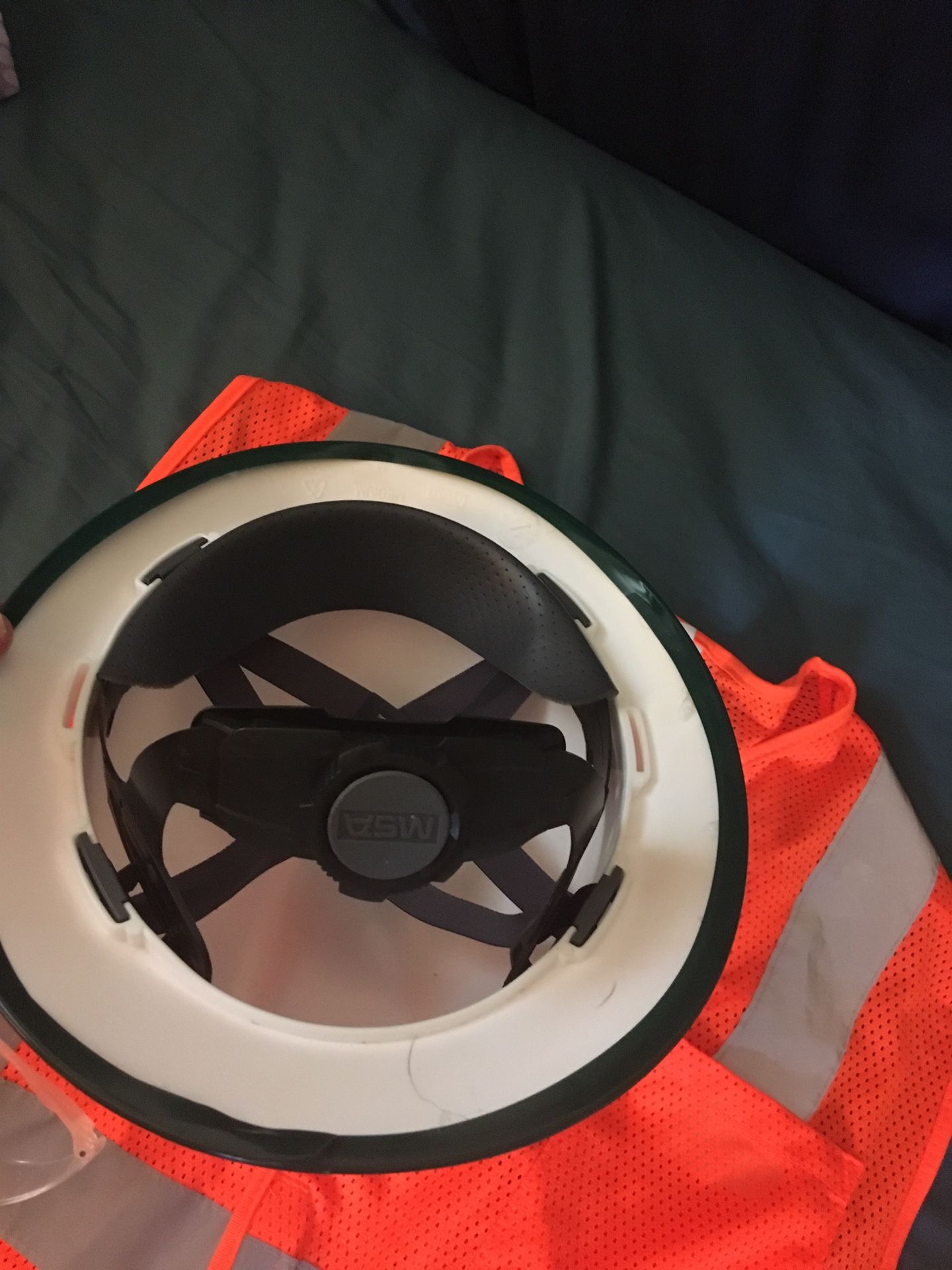 Safety helmet, reflective vest and safety glasses