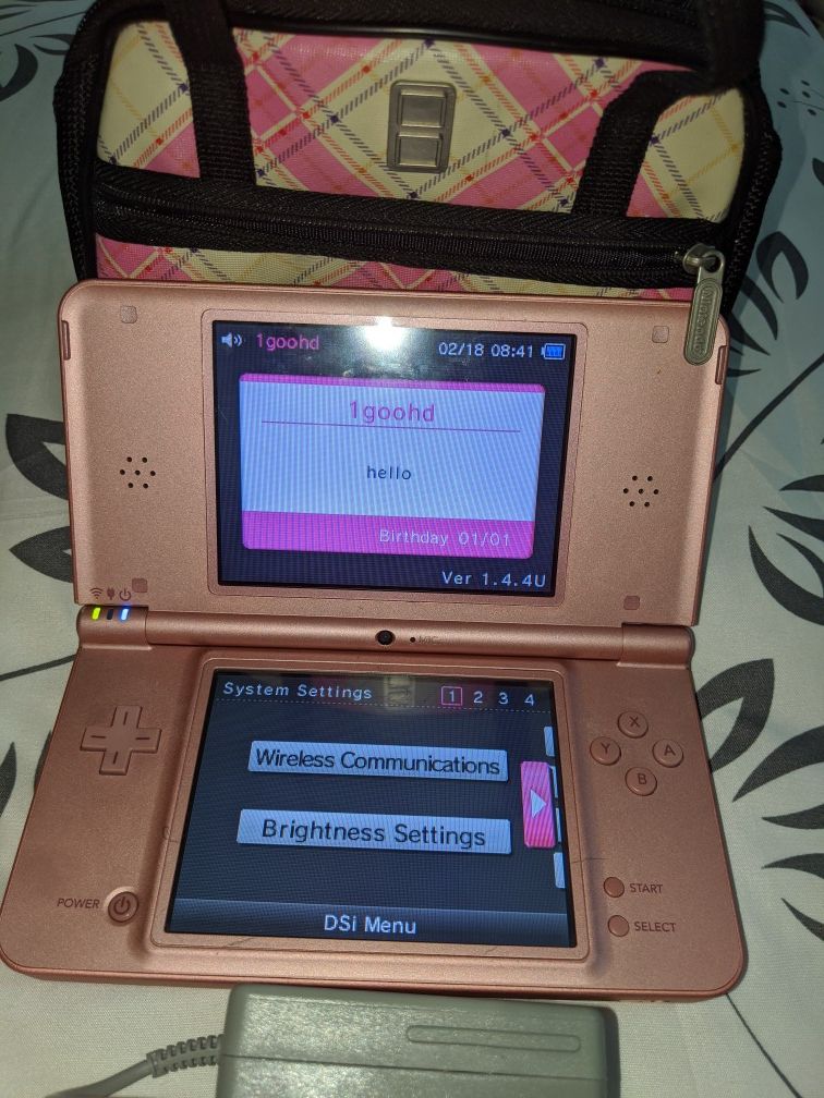 Nintendo Dsi XL, charger and accessory case in coral