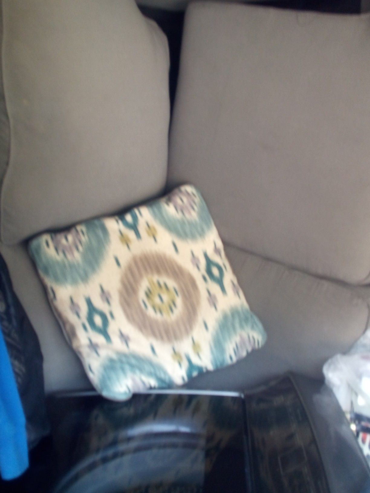 Miskelli's livingroom set. Couch, loveseat and chair. Couch and loveseat seat are solid grey with pillows that match the chair.