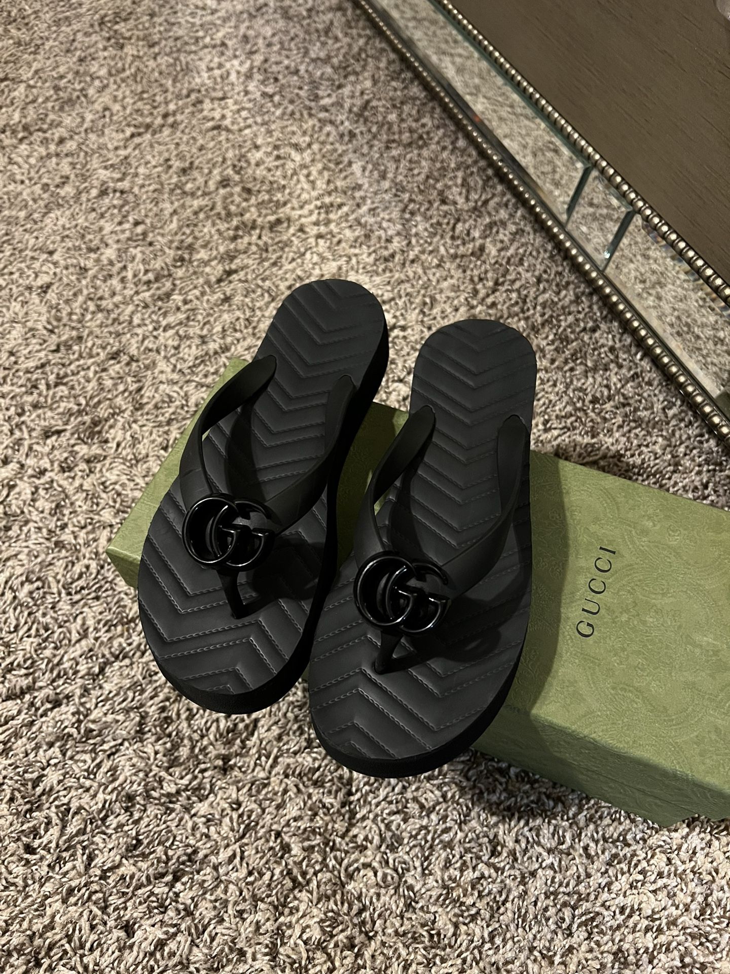 Black Gucci thong sandals