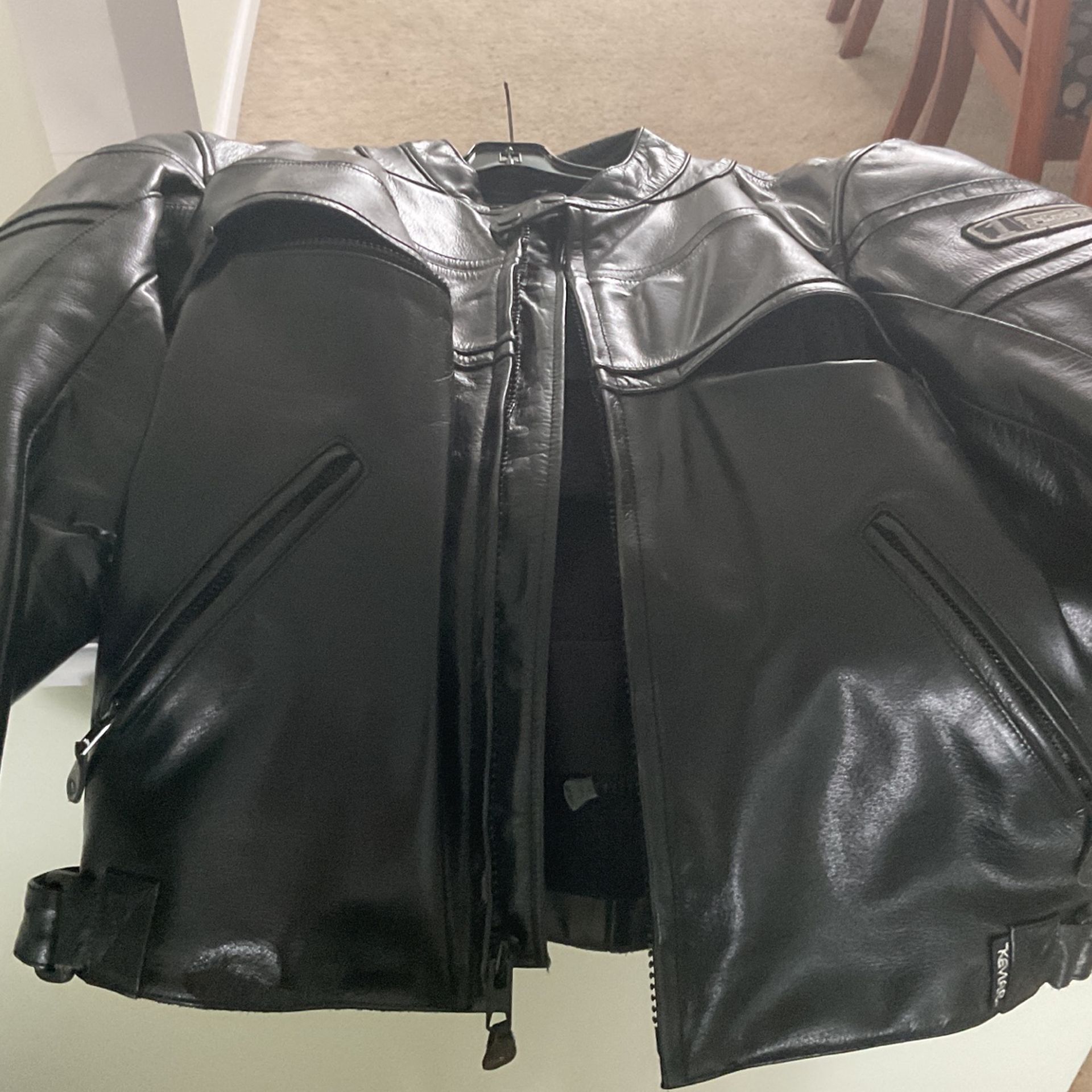 This is a motorcycle jacket larger with a padding at the elbows and back