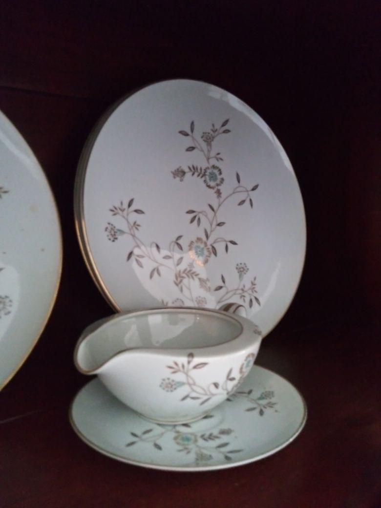 $100 beautiful Set of dishes edged in gold