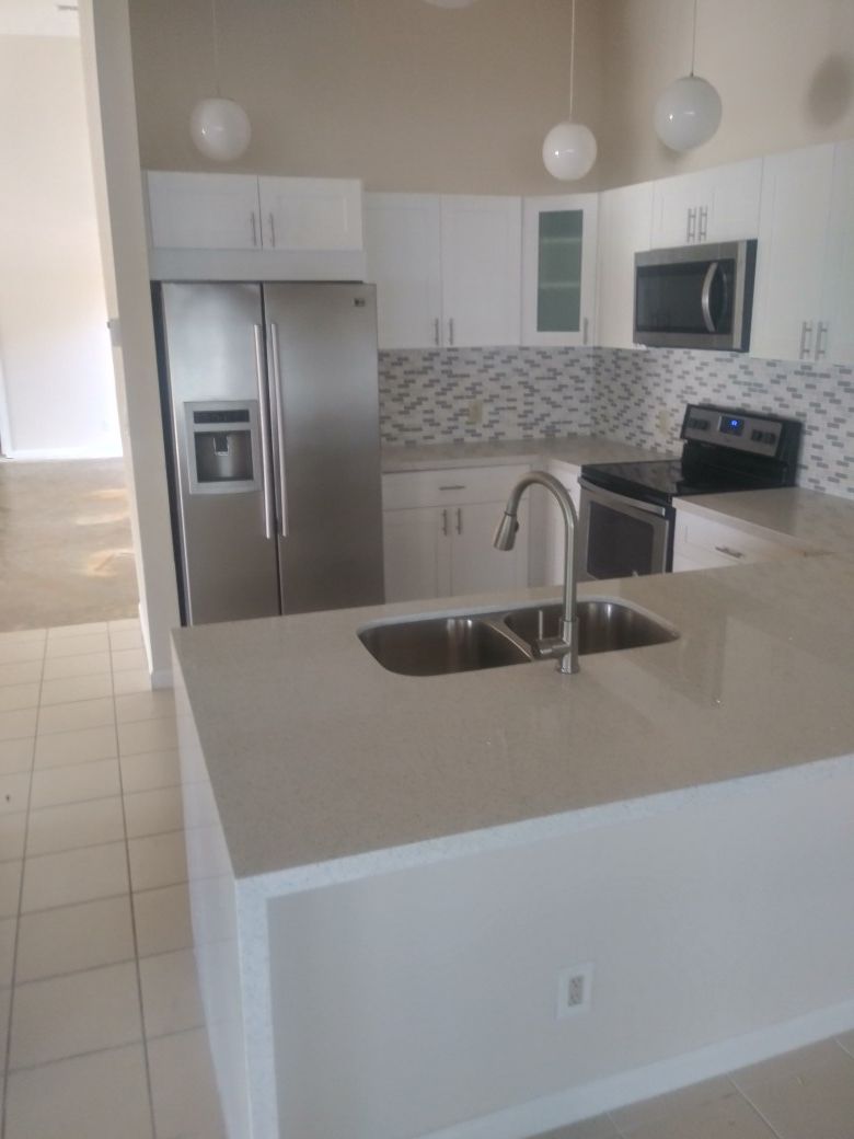 Solid wood kitchen complete with quartz