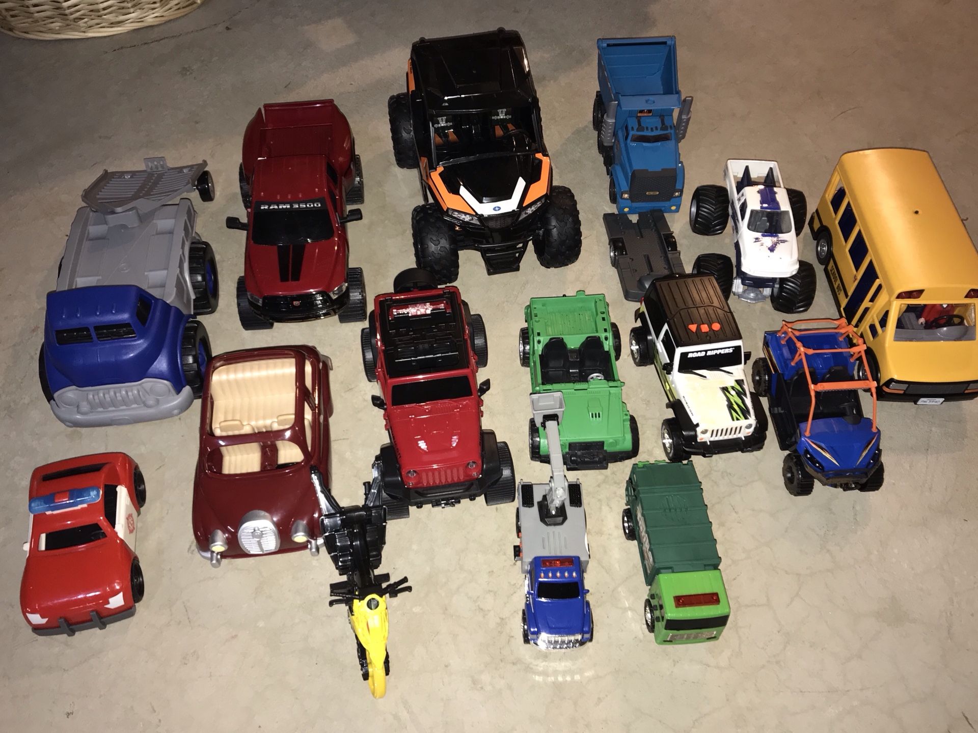 Huge lot of 15 trucks, cars, motorcycle, buss, two with trailers. Also includes dump truck, tow truck, monster truck.
