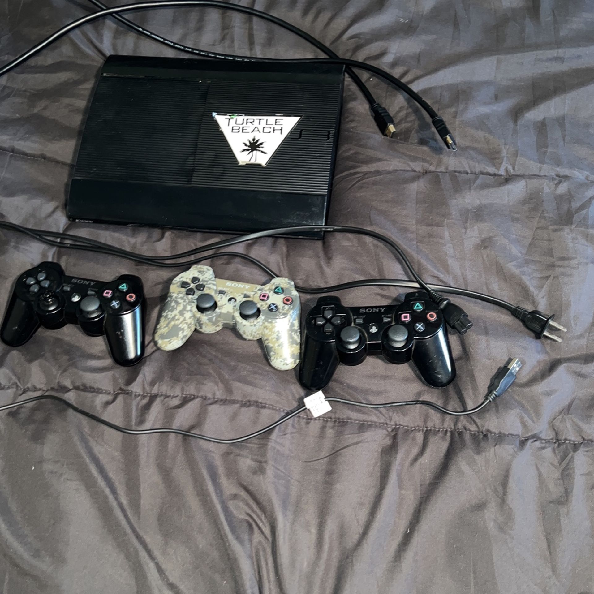 PS3 with 3 controlers, HDMI cable, Power cord and charging cord for controlers