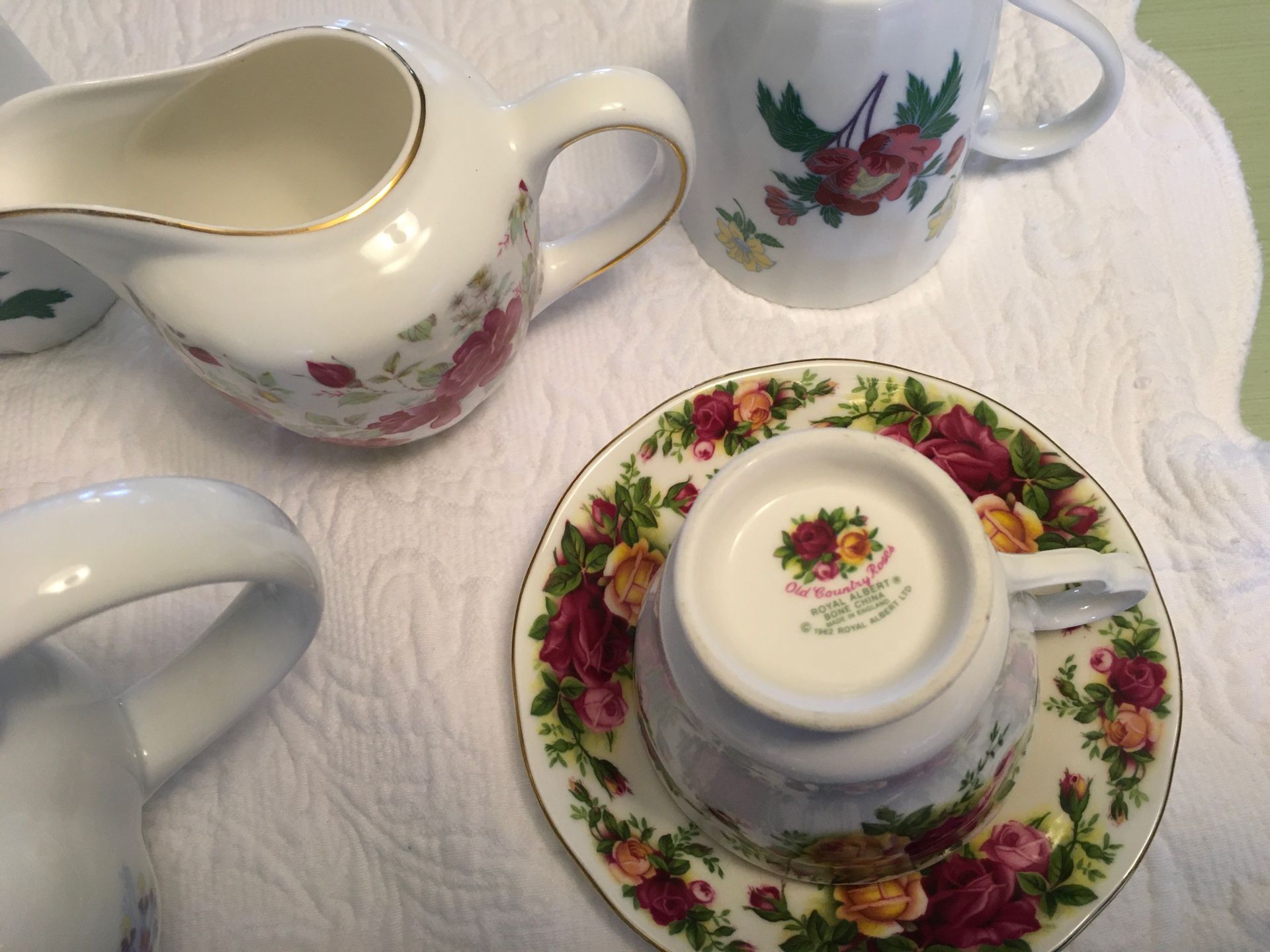 Laura Ashley China tea pot and assorted teacup and sauces ,and creamer