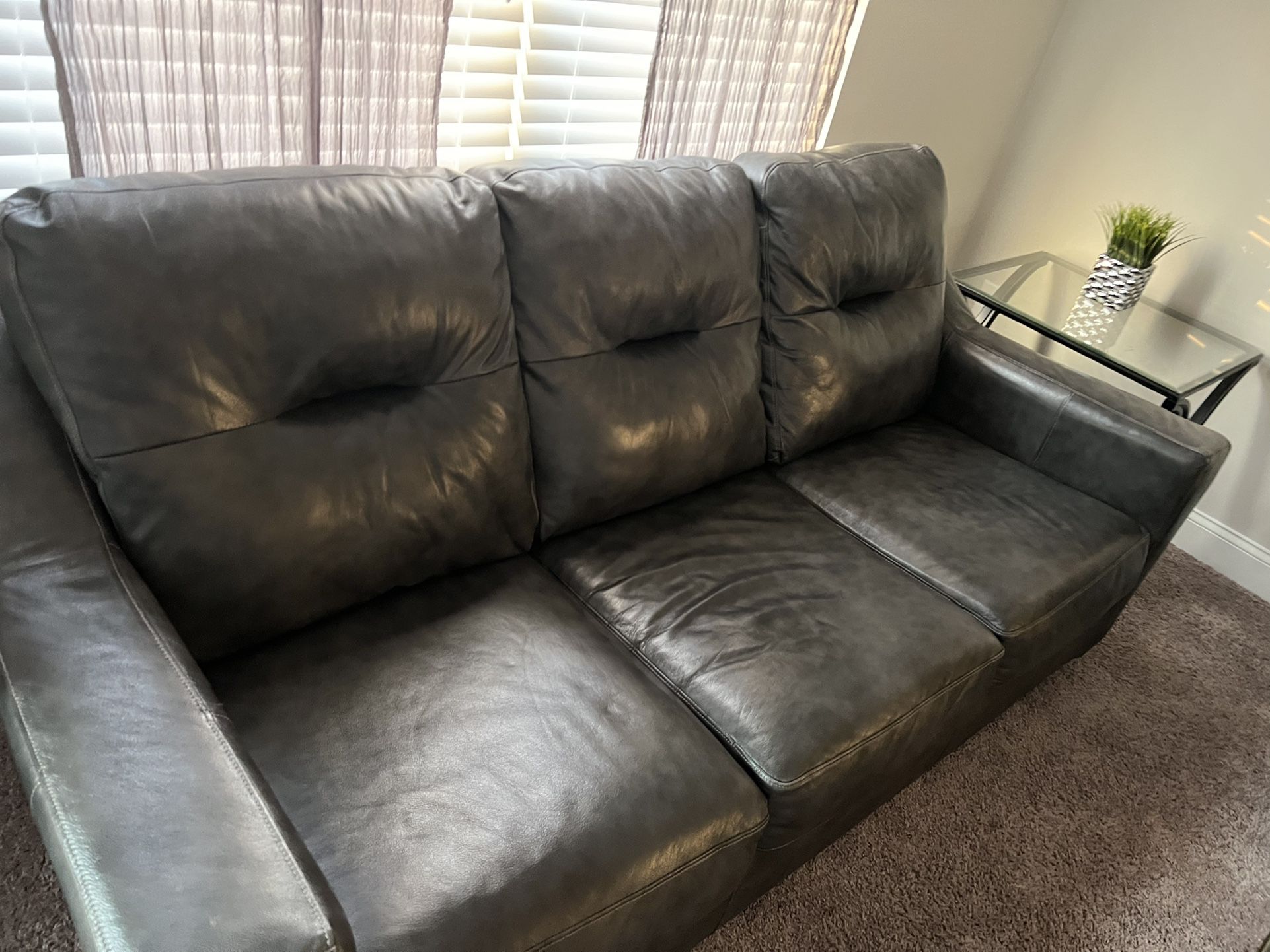 Dark Gray Leather couch and chair 