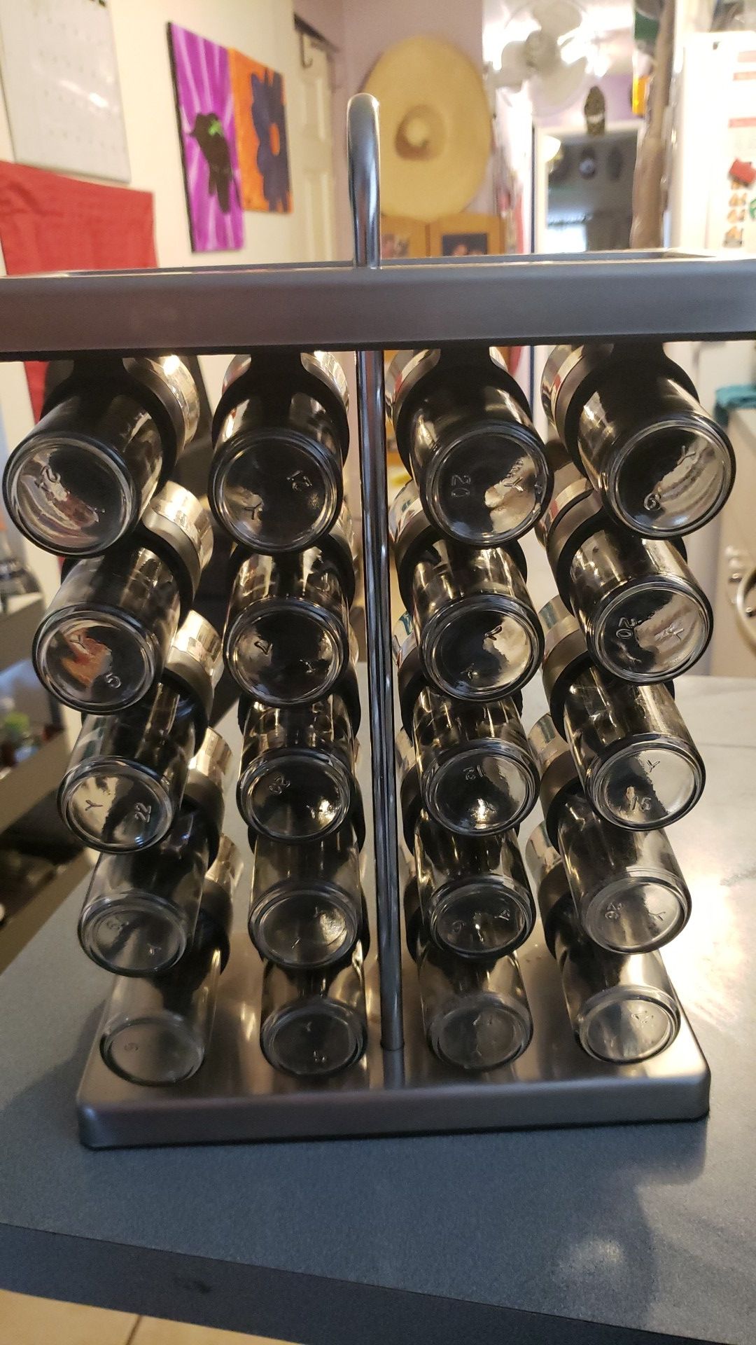 Spice rack with labeled glass jars