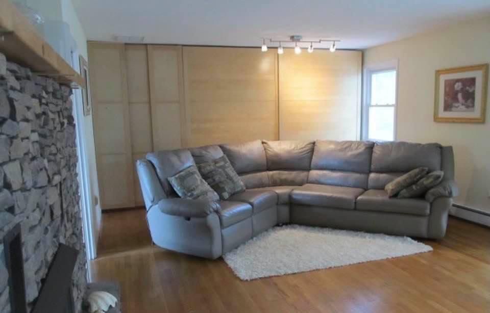 Real Leather Sectional Couch With Two Recliners And A Pull Out Queen Bed With A Matress.