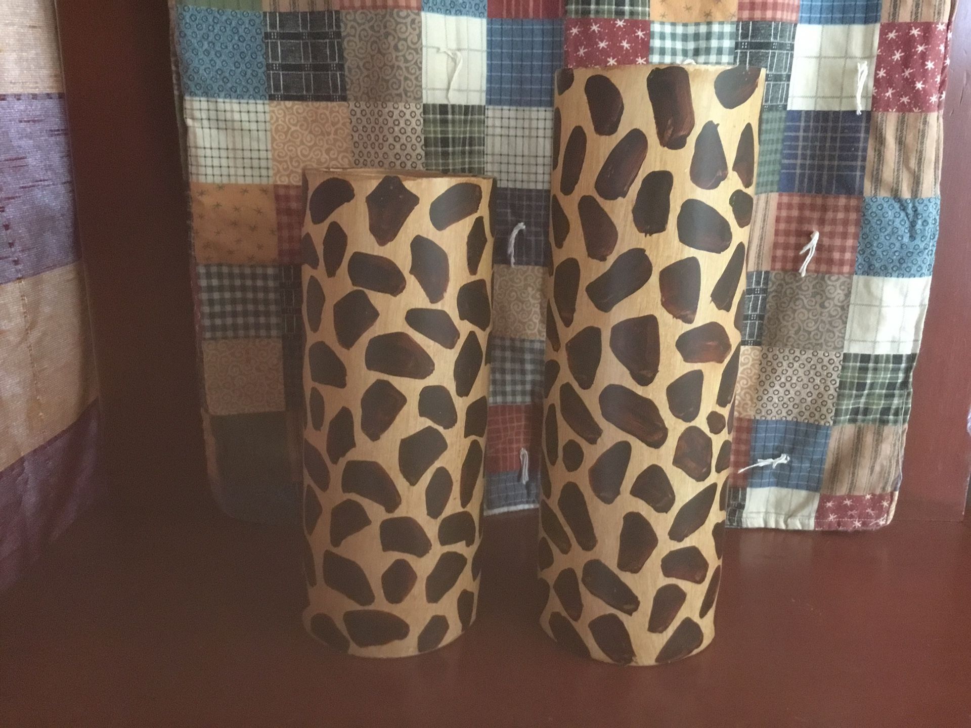 TWO WOODEN LEOPARD PILLAR CANDLE HOLDERS