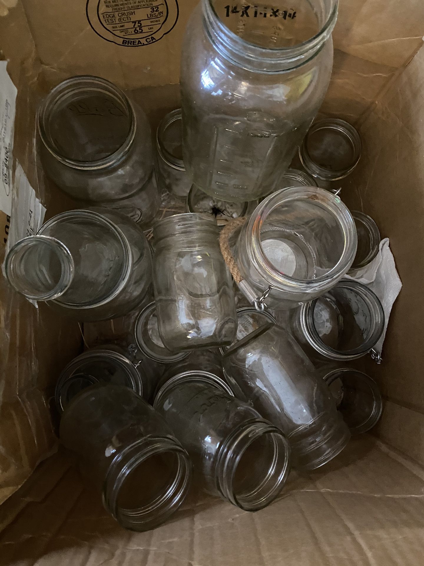 Assorted Mason Jars And Glassware