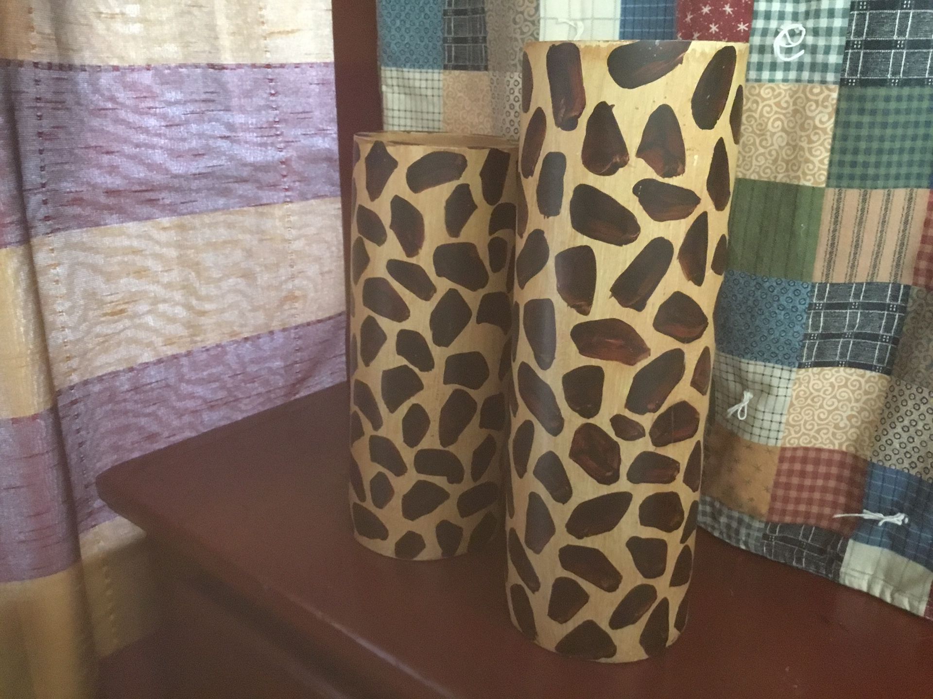 TWO WOODEN LEOPARD PILLAR CANDLE HOLDERS