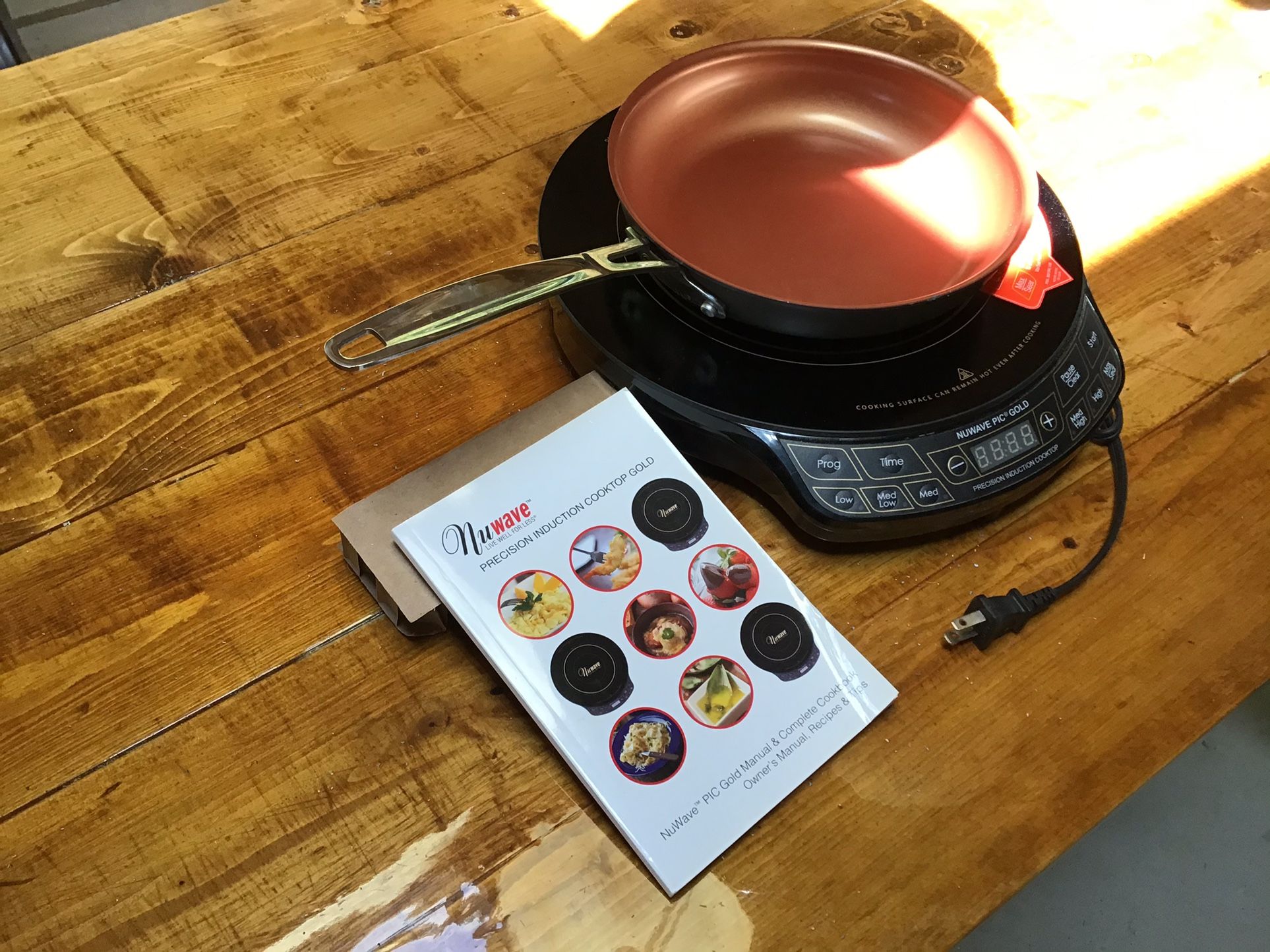 Never Used One Nuwave Precision Induction Cooktop Gold. Includes Owners Manual And Non-Stick Pan. Call John At (contact info removed)