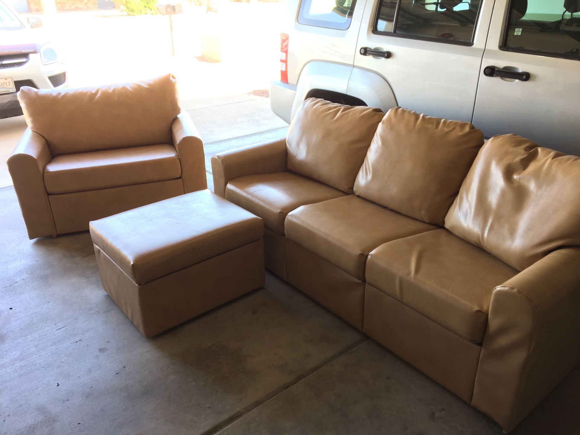 Home Reserve couch, loveseat, and ottoman. Built in storage. for Sale
