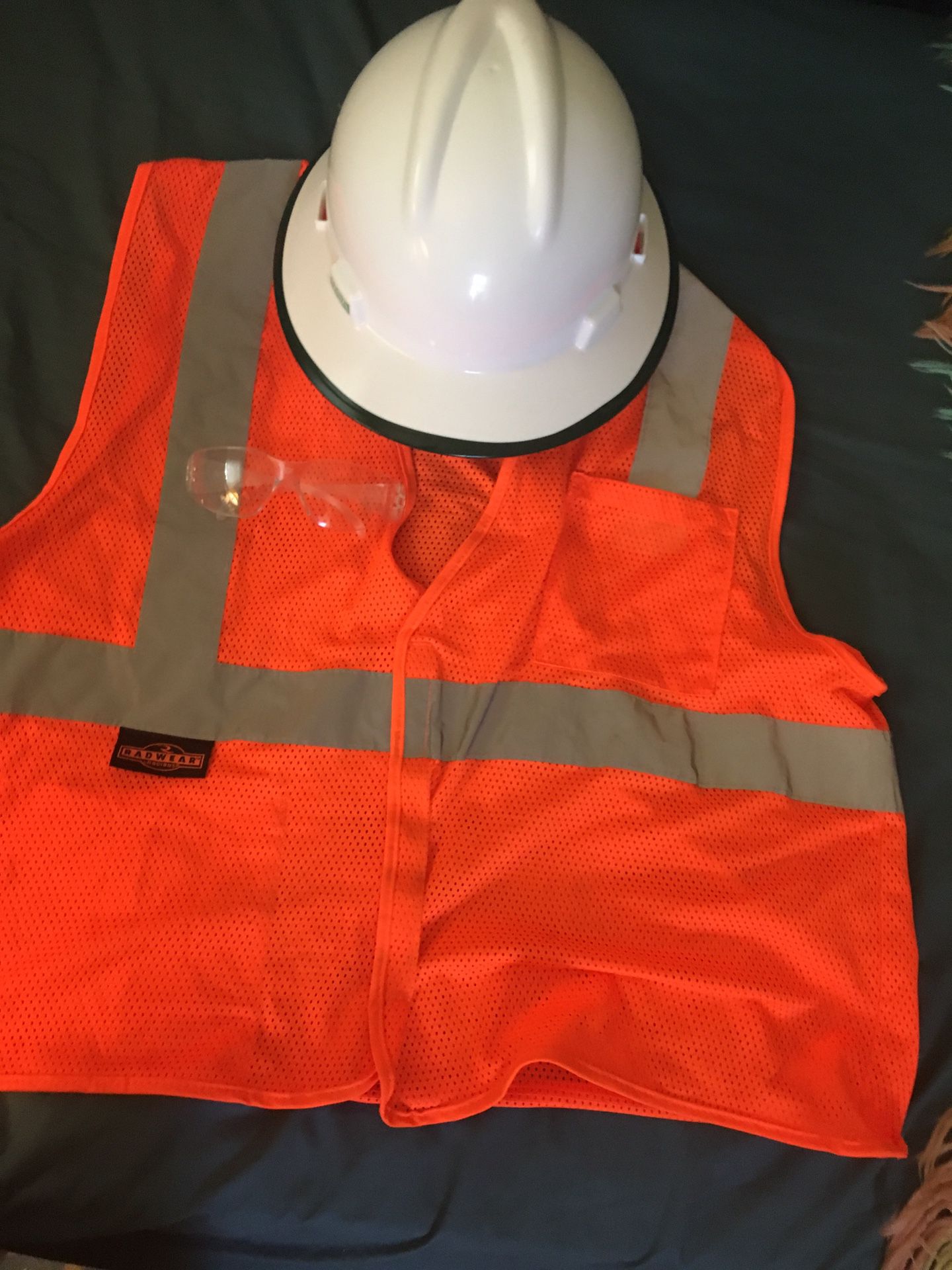 Safety helmet, reflective vest and safety glasses