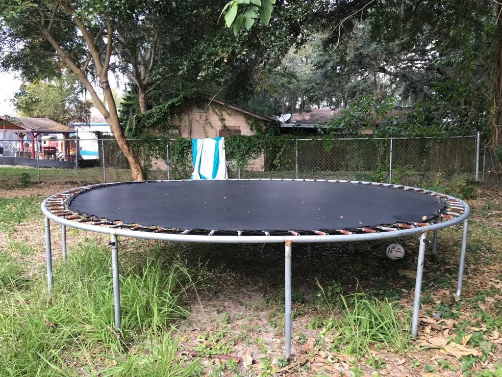 Trampoline And Basketball Hoop