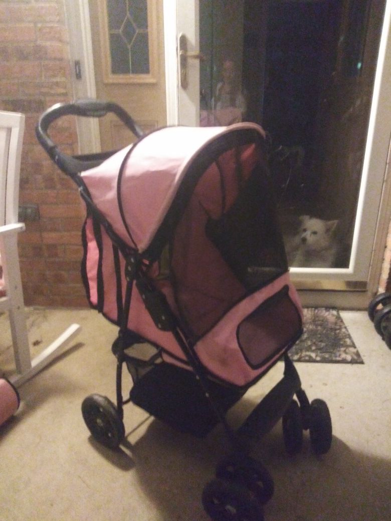 PINK DOG ANIMAL STROLLER (LOTS OF STORAGE UNDER STROLLER & DRINK CARRIER ON TOP)