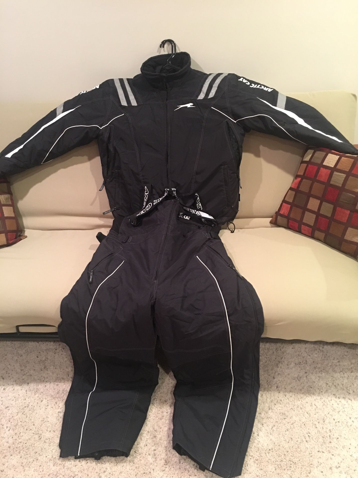 Snowmobile suite and boots and bag and gloves