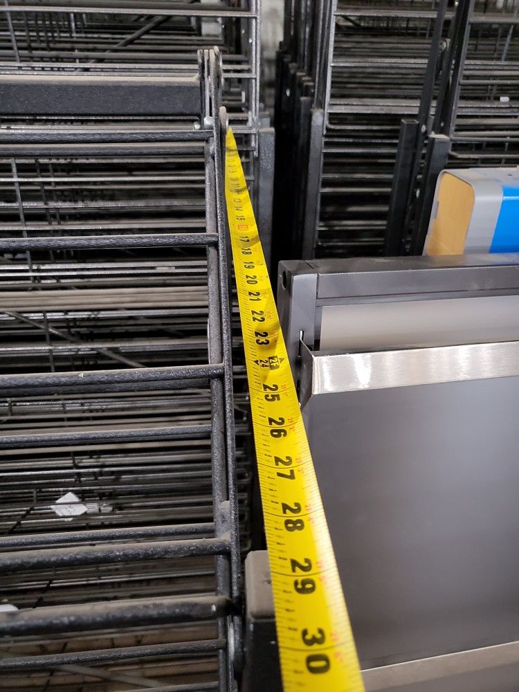 Double Sided Display Rack On Wheels With 7 Shelves On Each Side, Black Metal