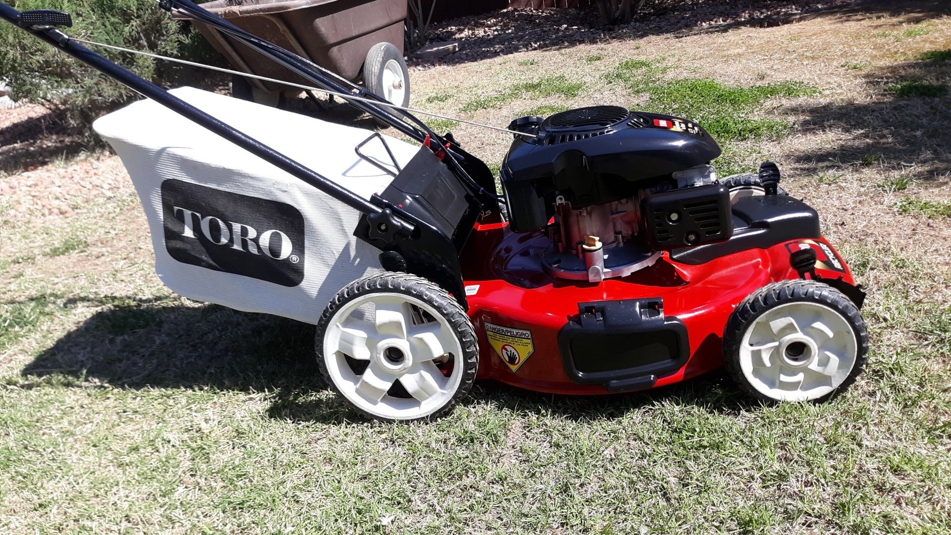 TORO FRONT WHEEL DRIVE , LAWN MOWER. REAR OR SIDE BAGGER. LIKE NEW. for