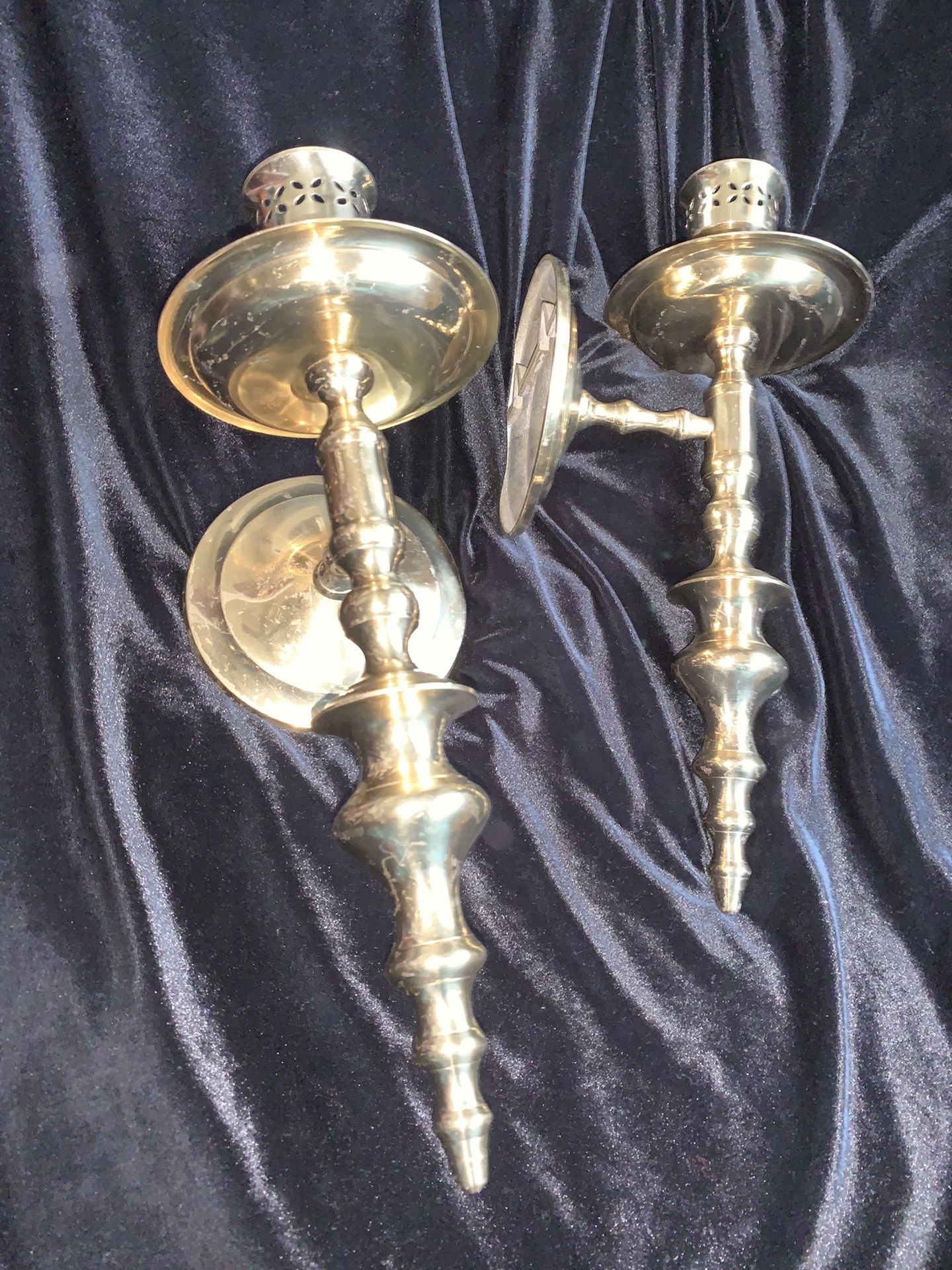 Brass wall candle holders.