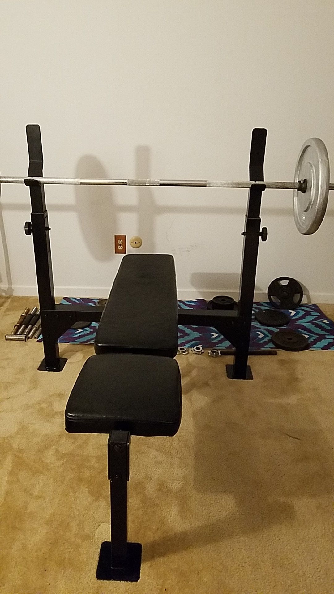 "Bench press "Olympic bench, and bar. 100lbs of weight. 135 total. 550