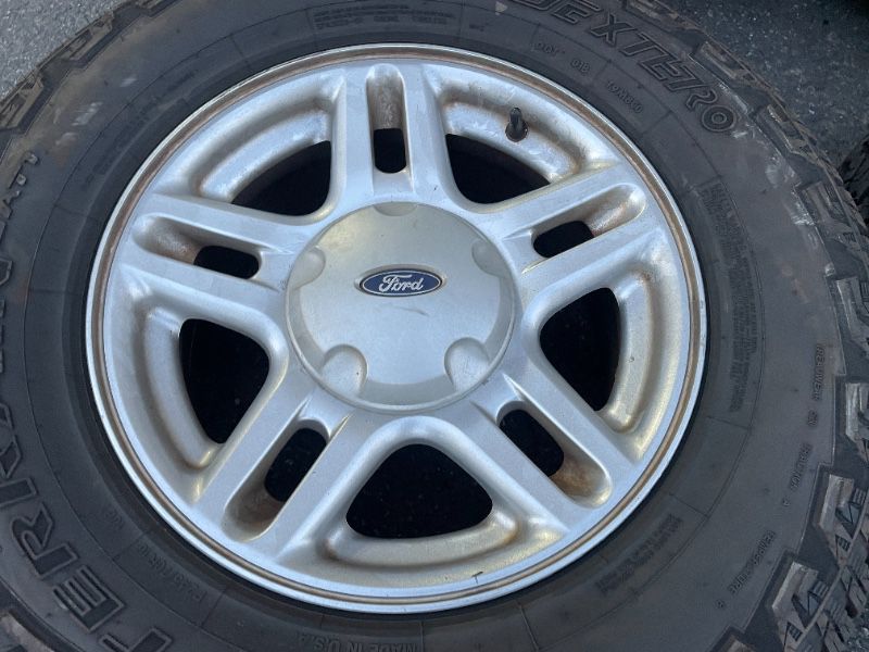 Ford Explorer 16 inch aluminum rims and all terrain tires. Fits Ranger - T02398