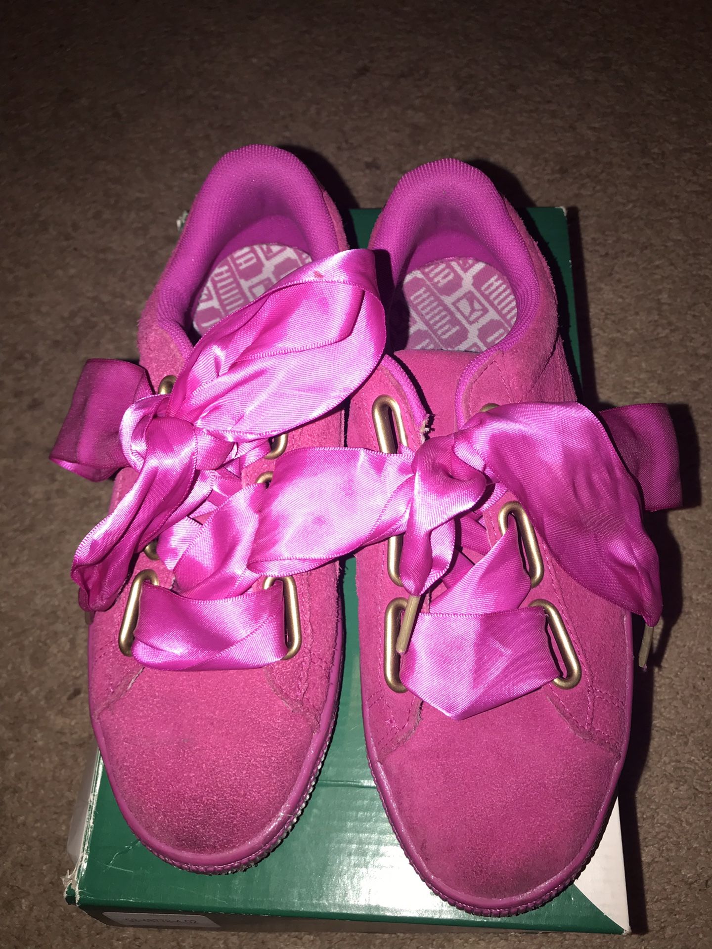 Gently used size 7 hot pink puma shoes with satin bow laces