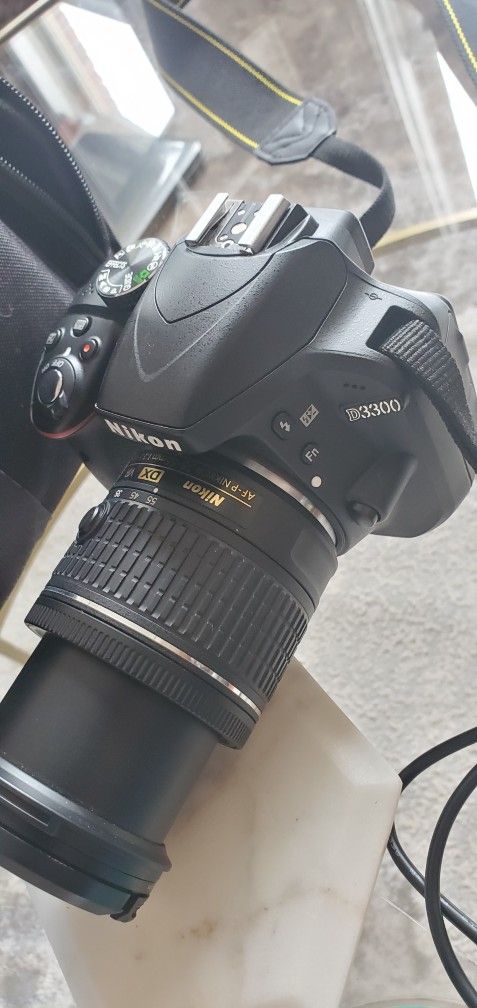 Nikon D3300 DSLR Camera with NIKON 18-55mm f/3.5-5.6G VR Lens, SanDisk 64GB Memory Card, 2 SanDisk Adapters, Case, Tripod and Accessory Bundle