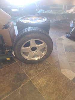 rim with everything and tire for chevy silverado with 8 lugs in very good condition Thumbnail
