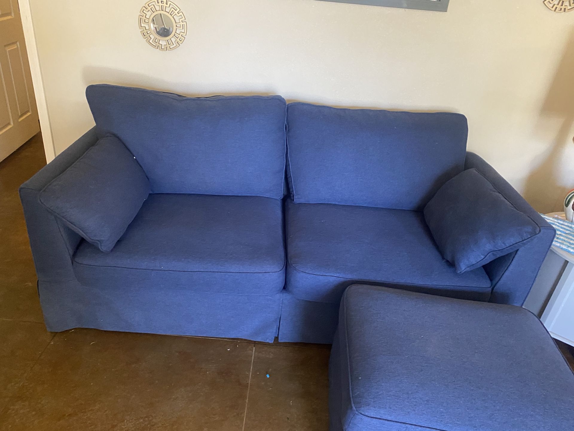 Blue Upholstery Couch And Ottoman