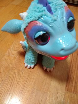 FurReal friends Torch My Blazing Dragon interactive 11 inch toy. Talks and breathes steam. Works perfectly. Retails for 200. Google it. Thumbnail