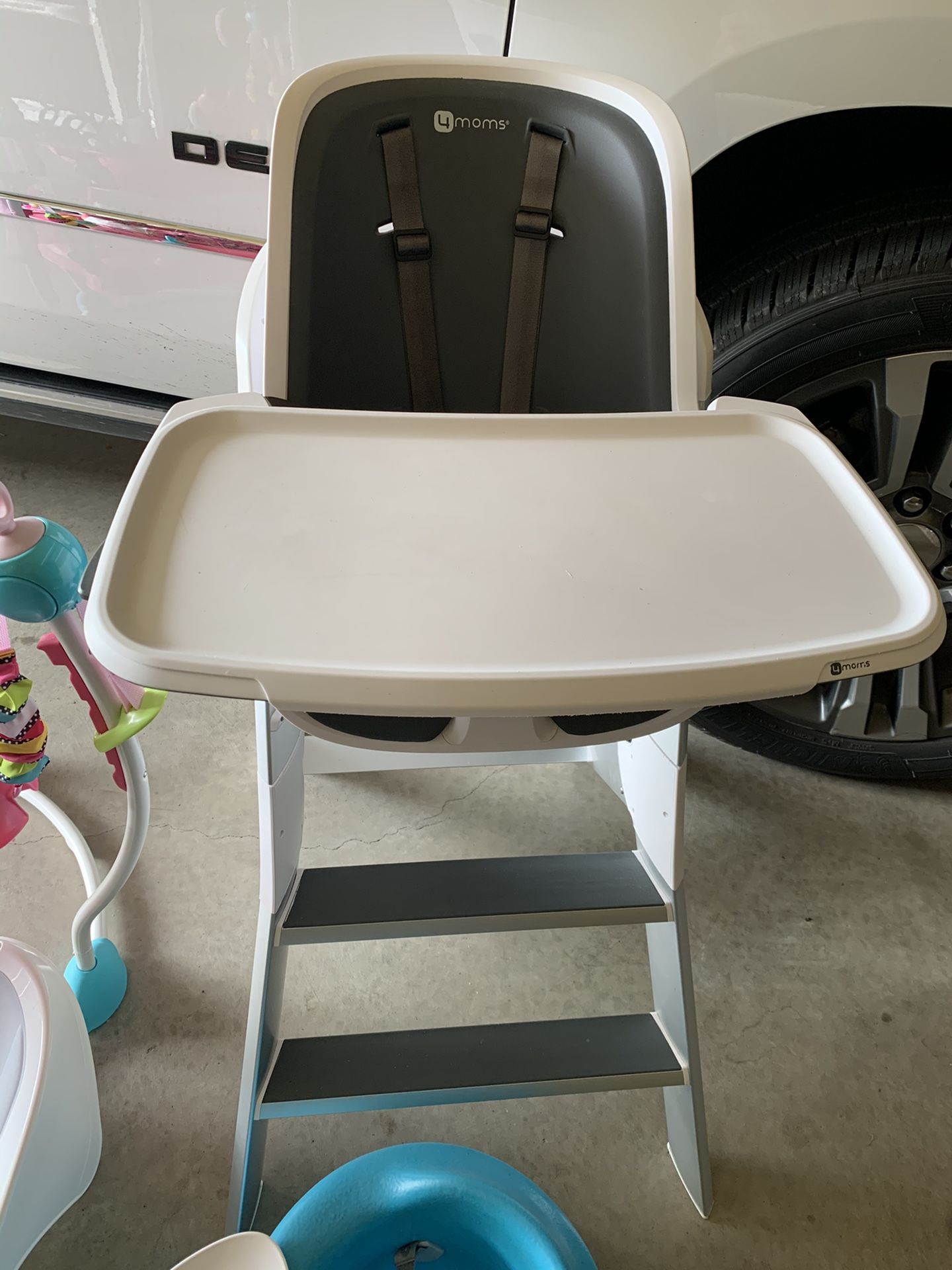 Baby jumper, formoms high chair, shower/bath lounger and a bumbo chair